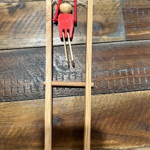 Wooden German trapeze man toy